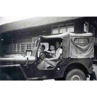 Old photo of a Jeep with Mr Lehmann and his son at the wheel