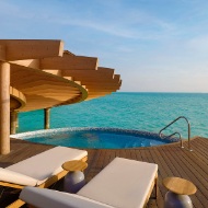 View of the sun terrace of one of the water villas overlooking the Red Sea