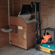 A stacker with shovel feeds a module conveyor system with salt