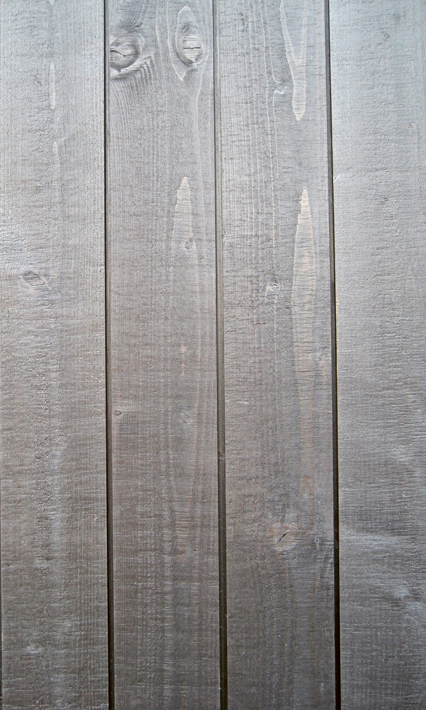 Facade with vertical grooved cladding, bandsaw cut and pre-greyed coating