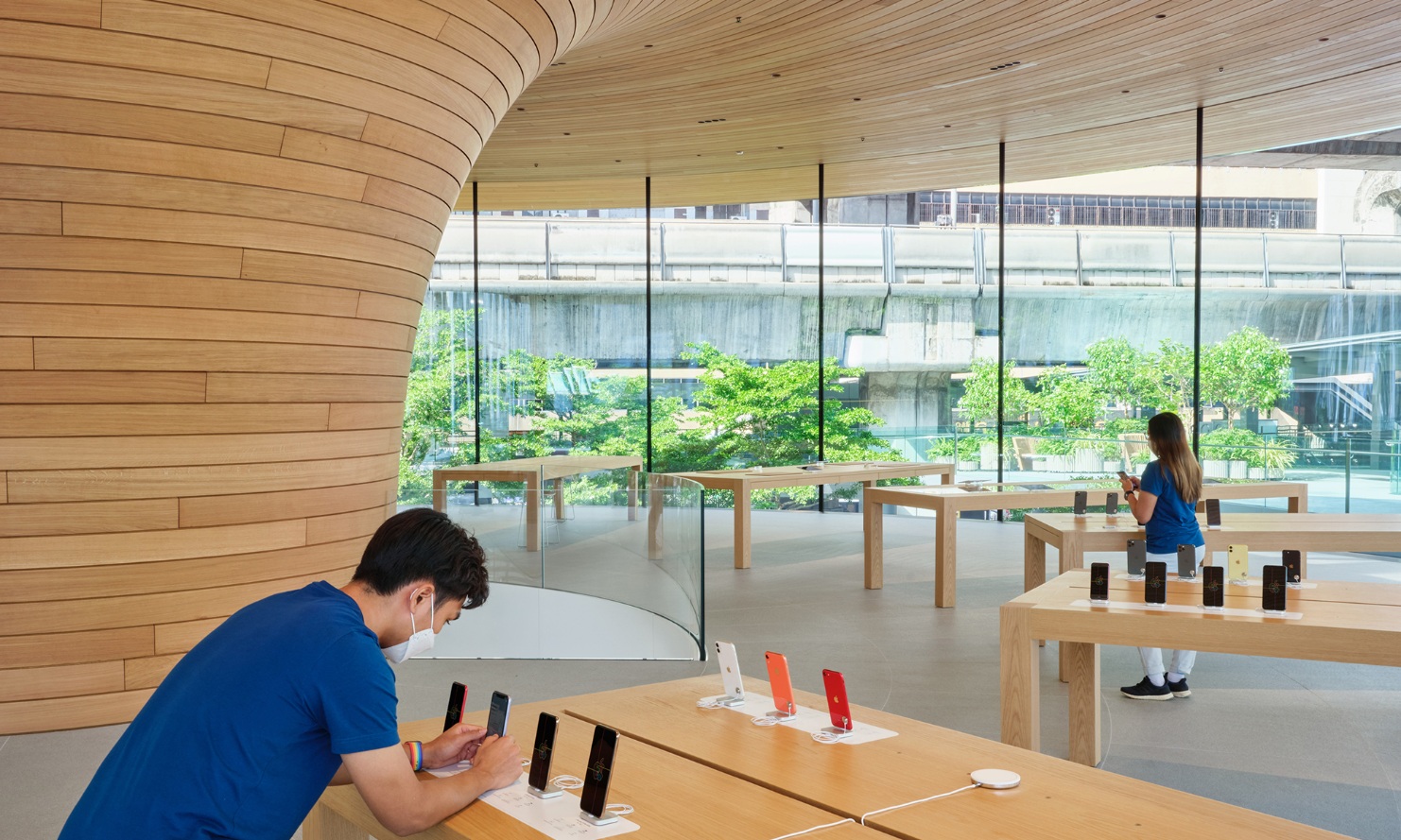 Product presentation in the Apple Store Bangkok under tree canopy