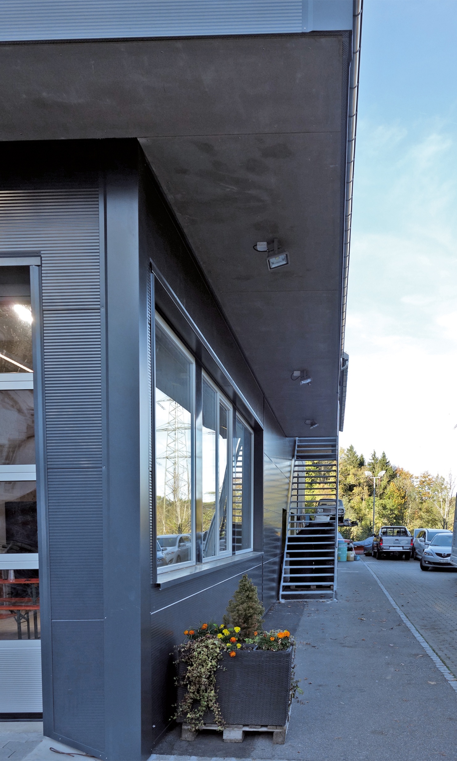 Side view of the facade of the new replacement building for the Mazda garage