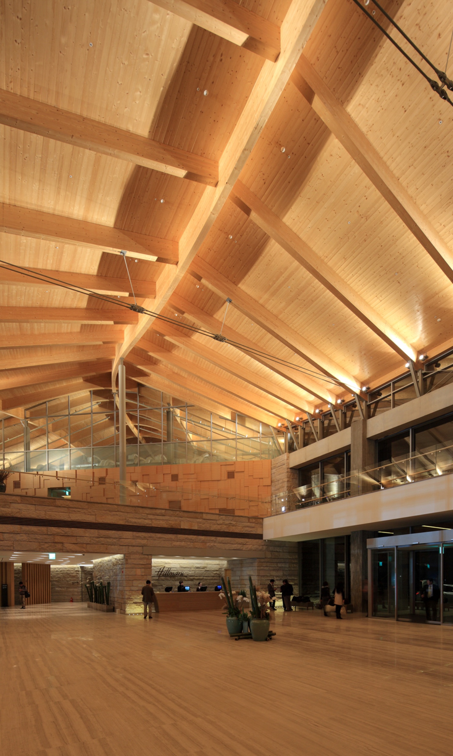 Illuminated entrance hall of the Hillmaru golf clubhouse at night