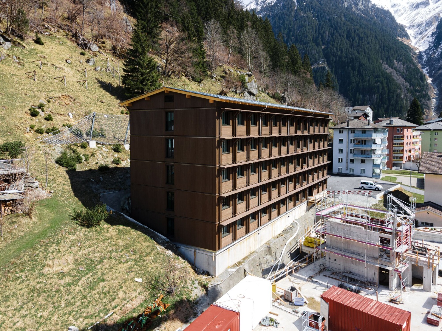 The staff accommodation building with its dark facade forms part of the Breiti residential complex