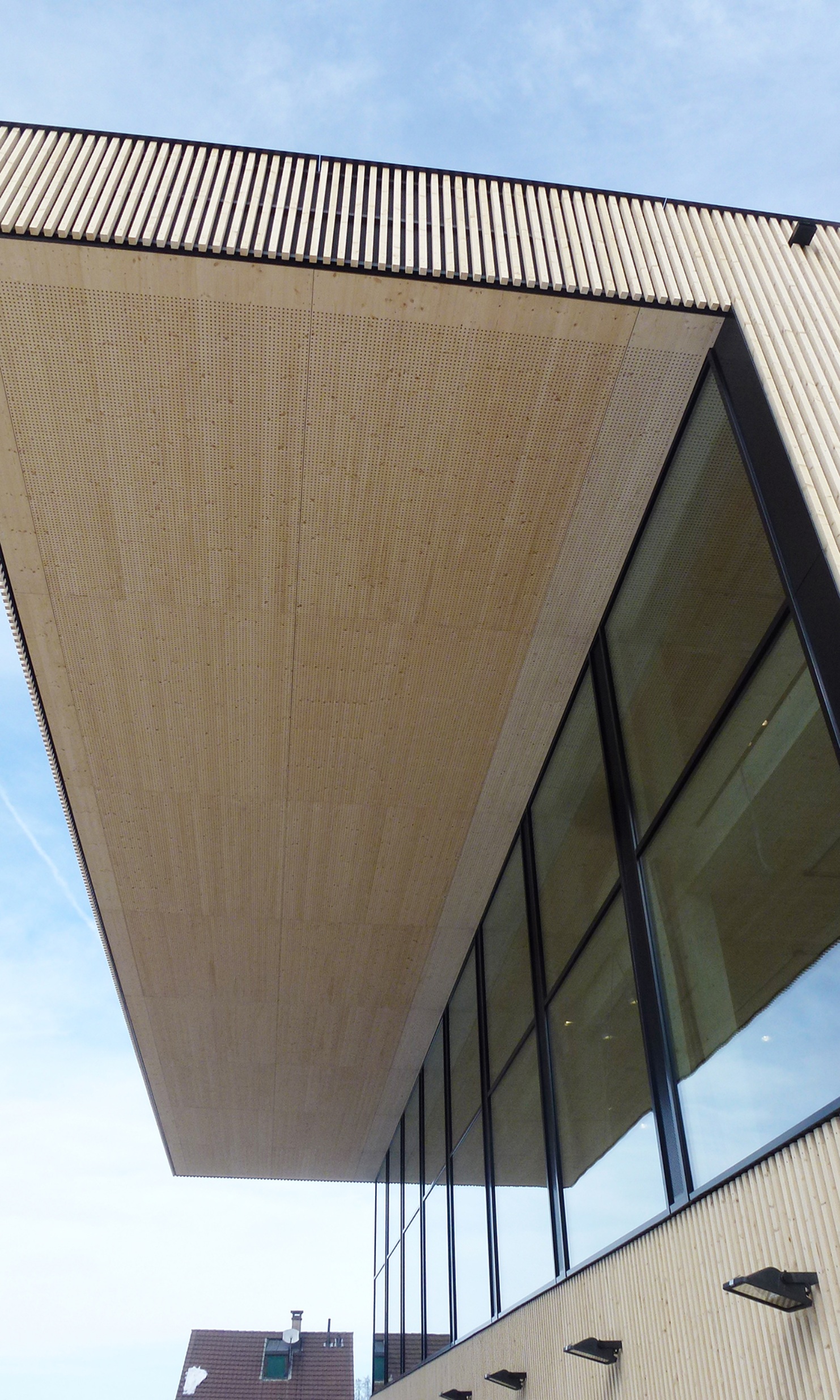 View from below of the imposing roof underside of an industrial building