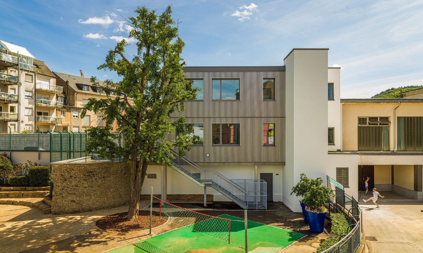 Exterior view of the new school building in modular timber construction
