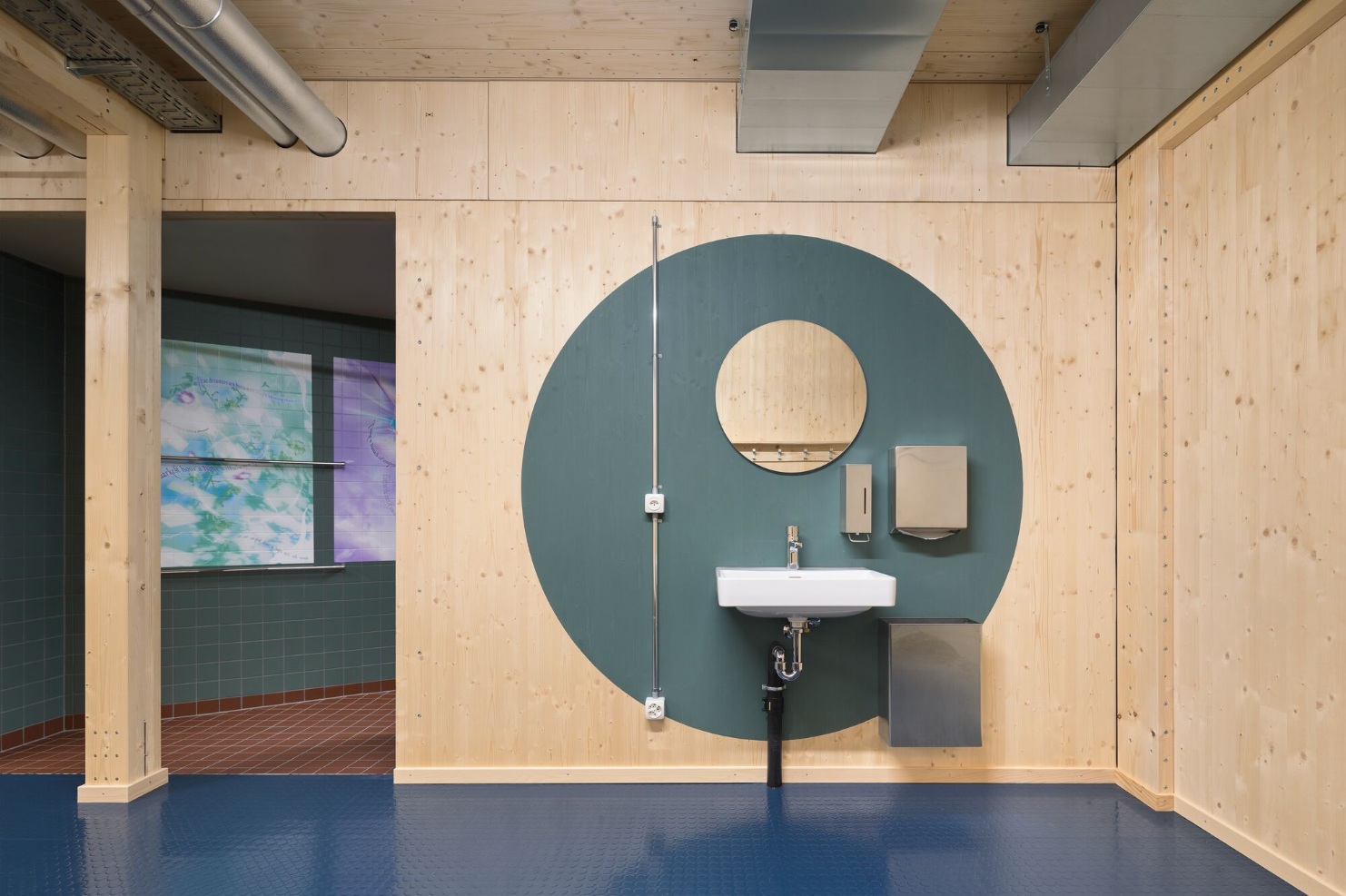 WC/shower/changing room area made of wood of the temporary gymnasium <br/>