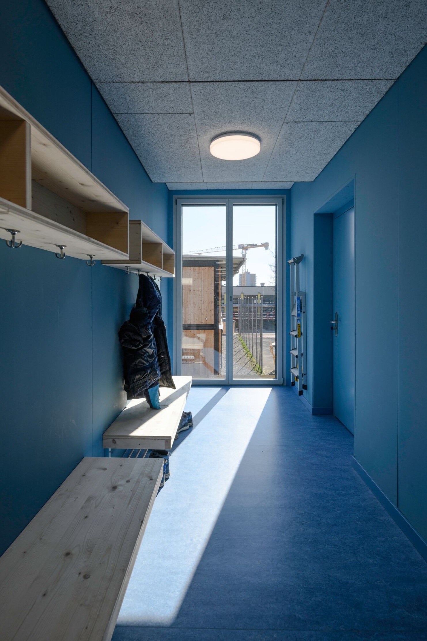 Cloakroom area with natural light in the Herti school facility<br/><br/>