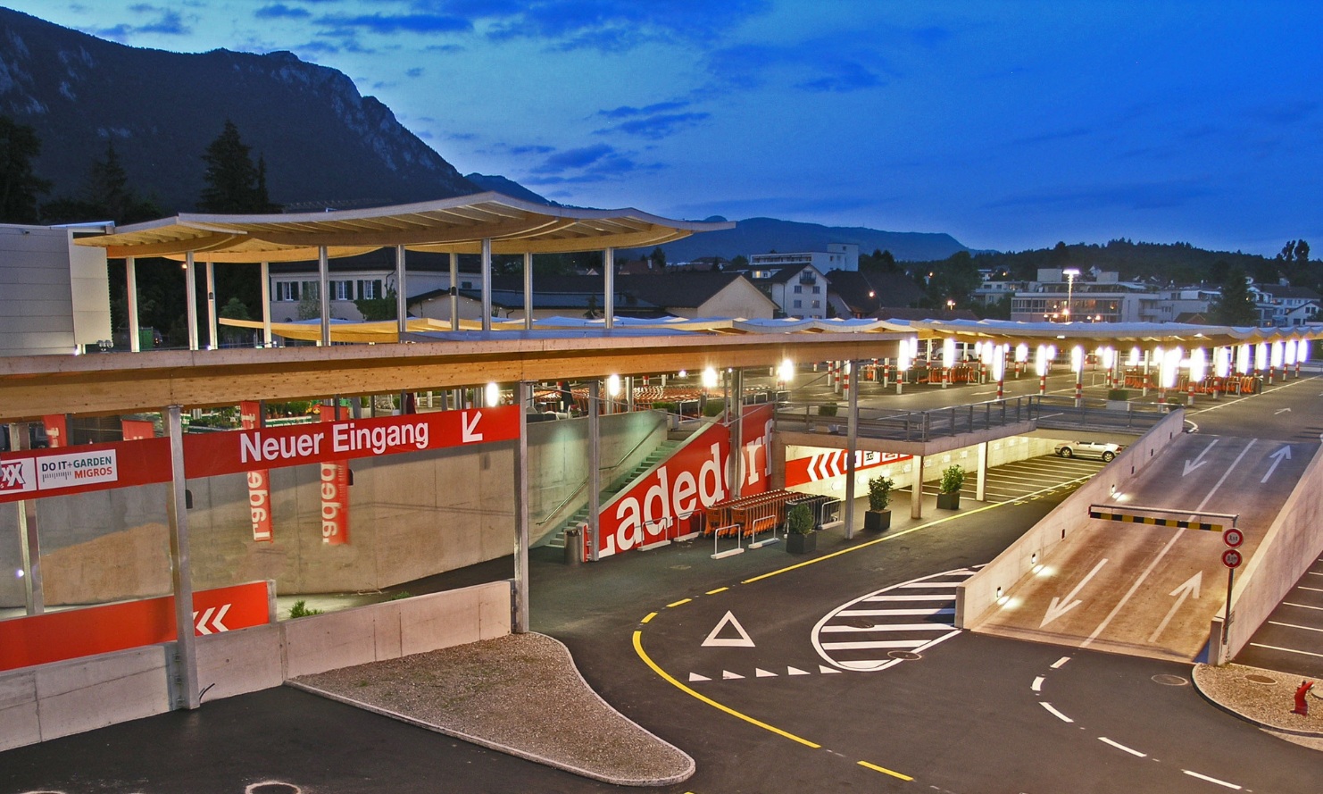 Overall view of The Umbrellas car park roofing in Langendorf at dusk