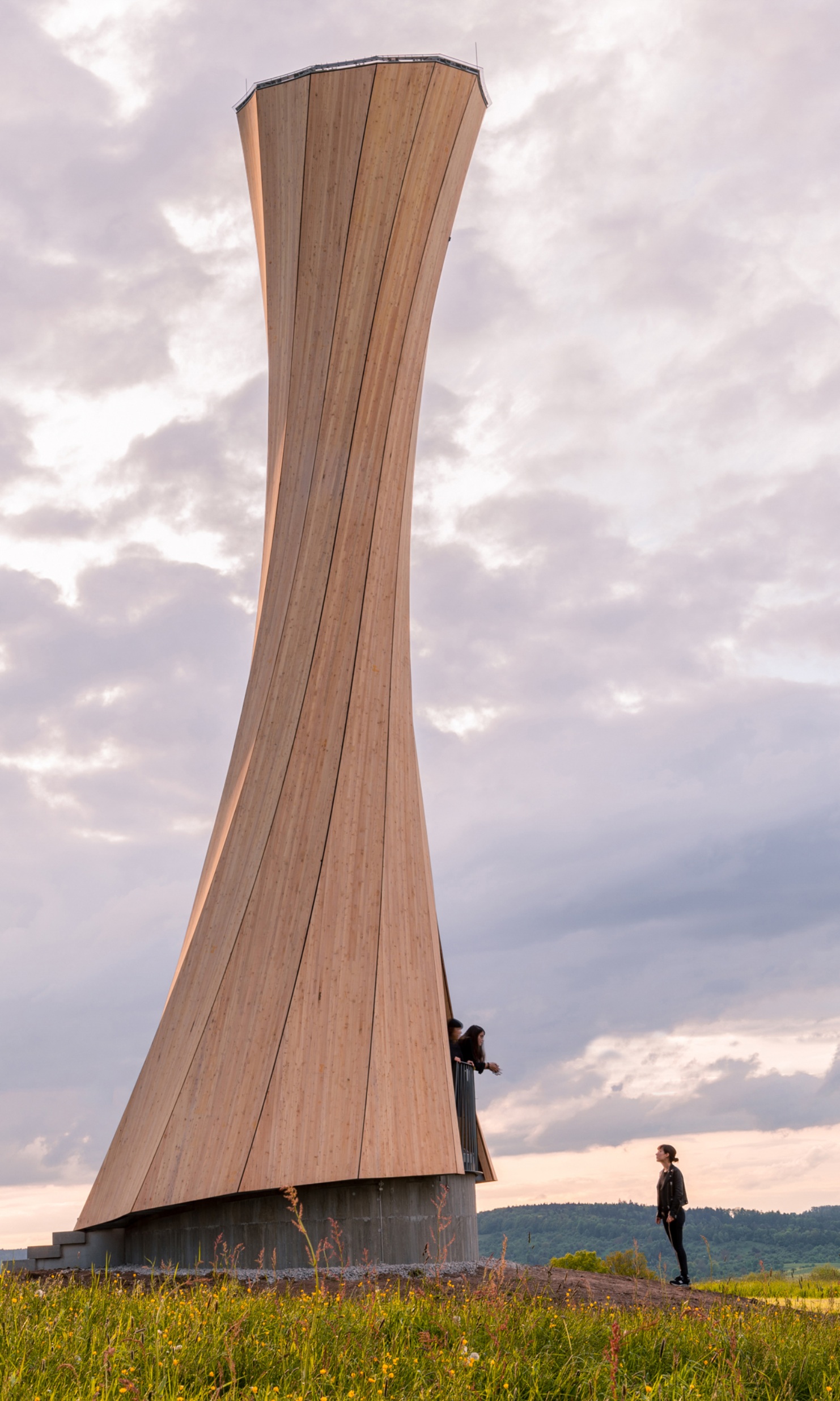 View of 3 people in the Urbach Tower in the evening sun