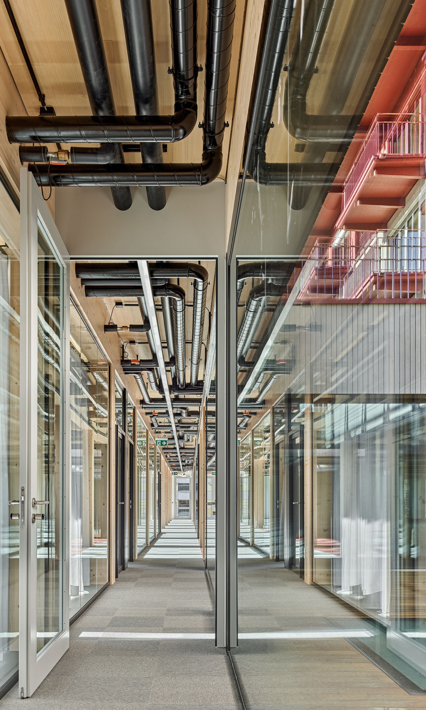 View into the corridor of the new "Baggiwood" building in Wallisellen