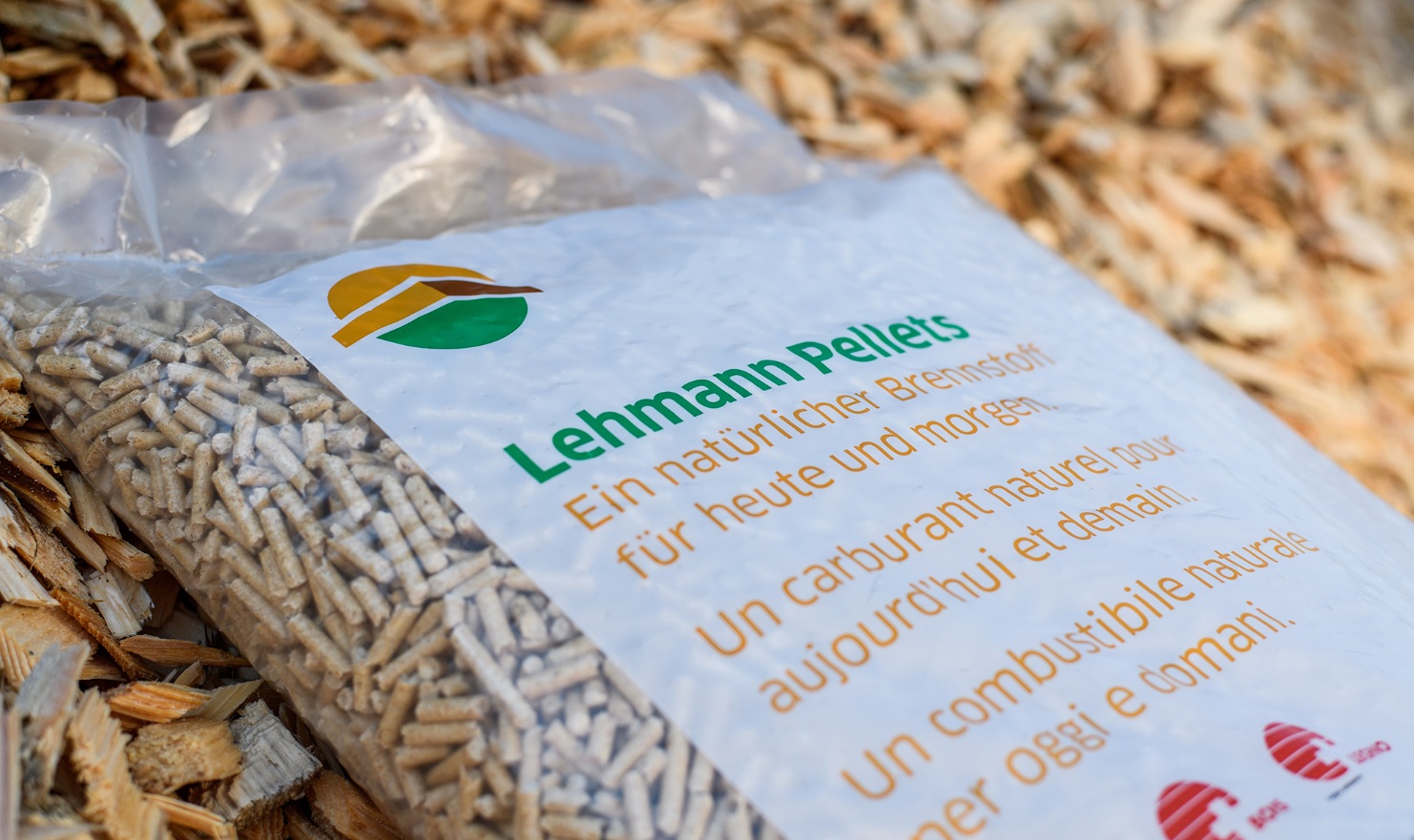 Close-up of a sack with Swiss pellets on a pile of wood chips