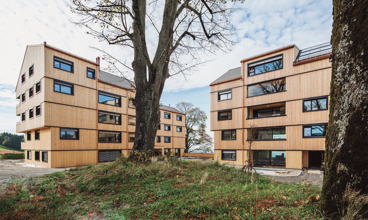 View of the multi-story timber construction in Vögelinsegg, Speicher, with a Swiss timber facade