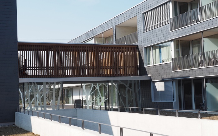 External view of the southern facade and timber building connection