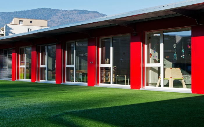 External view of the kindergarten modular construction with garden in fine weather