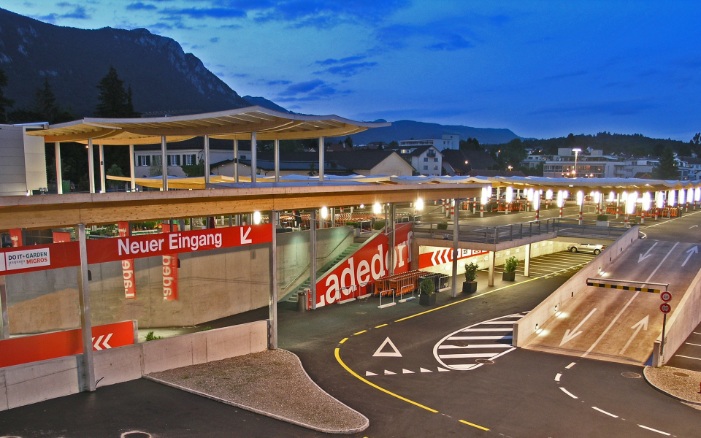 Overall view of The Umbrellas car park roofing in Langendorf at dusk