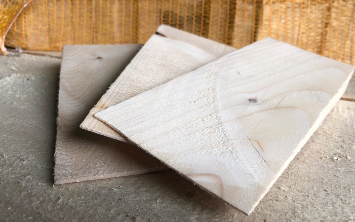 Construction wedges lying on a wooden board