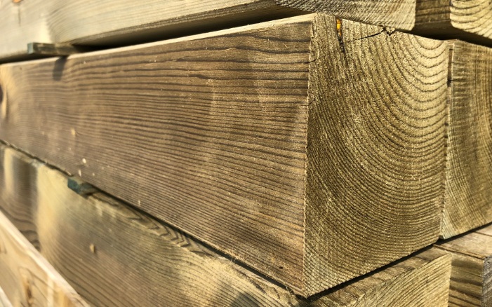 Close-up of pressure-treated square timber