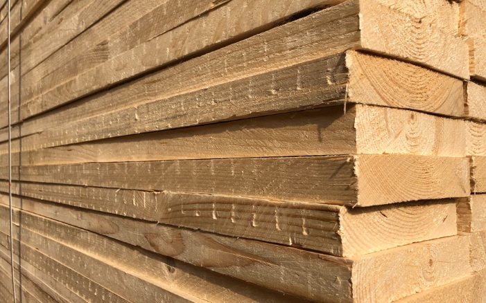Stack of rough-planed timber in the sunshine