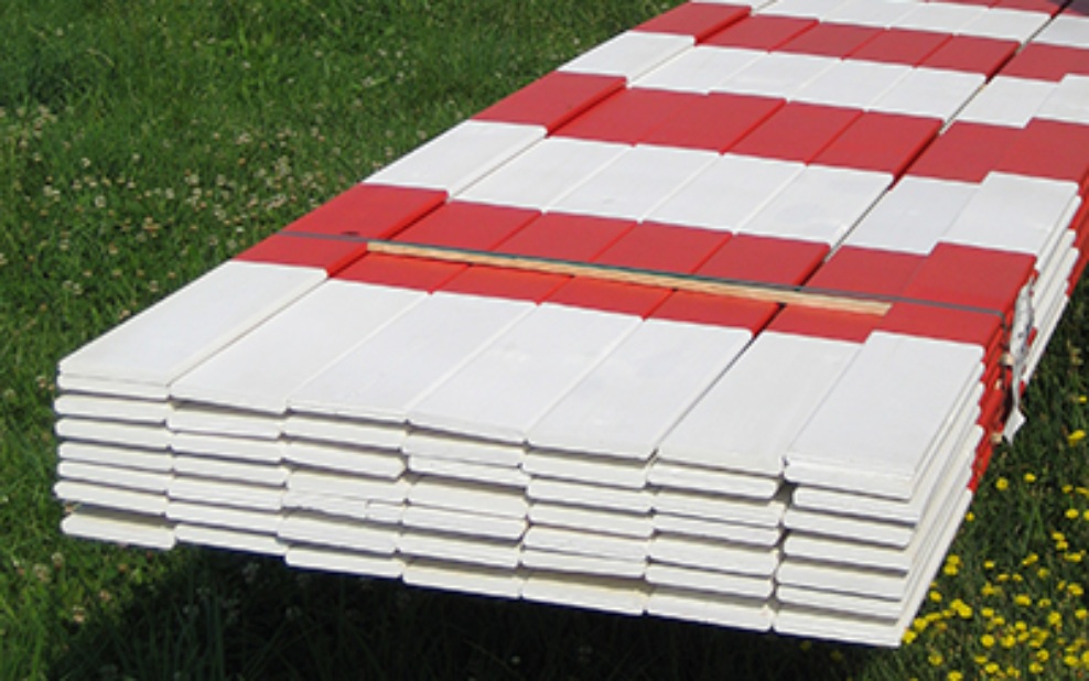 Barrier slats lying in a field