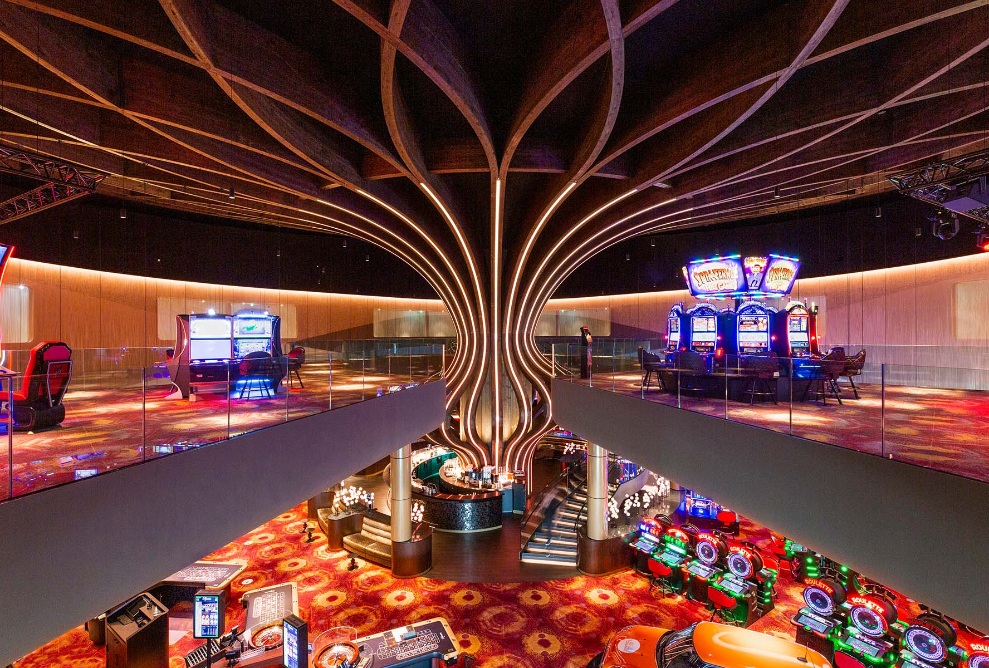 The free form wooden column is the centrepiece in the atrium of the Holland Casino in Venlo