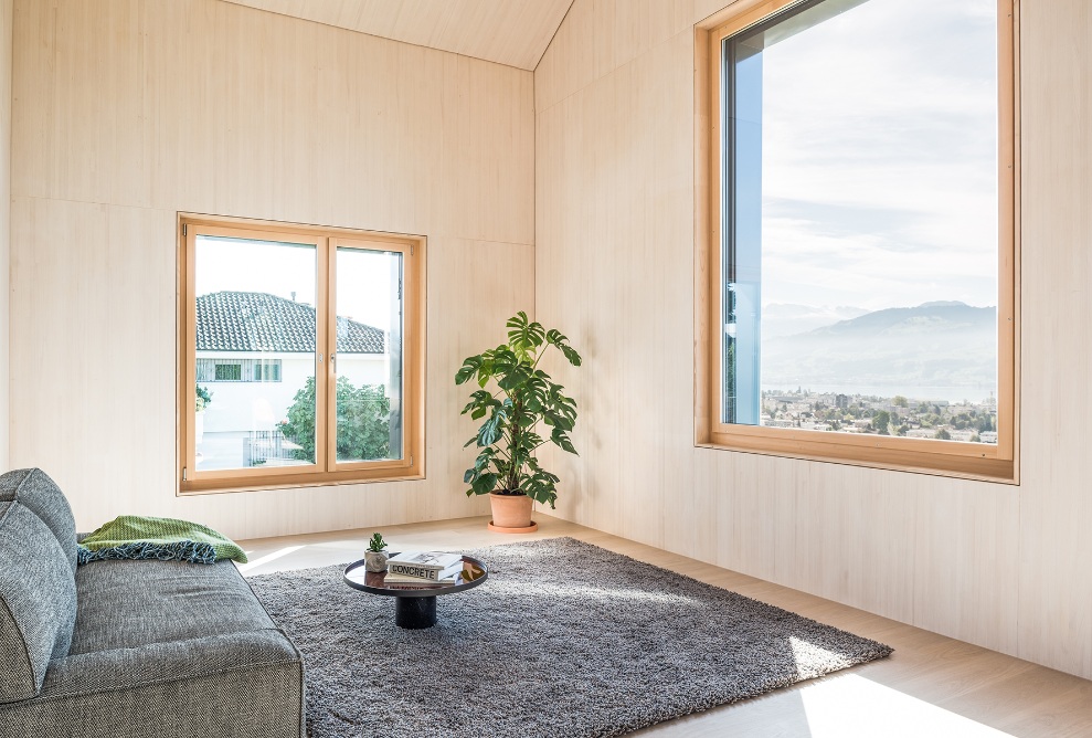 Lake views can be enjoyed from the sofa.