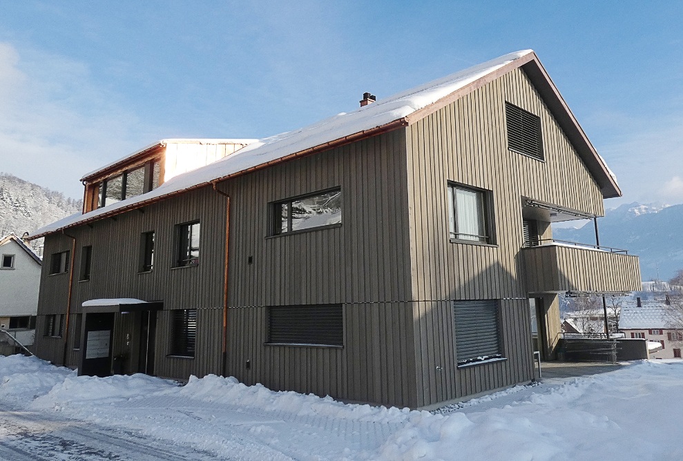 Overall view of the apartment building in Azmoos from the rear of the building, including the entrance