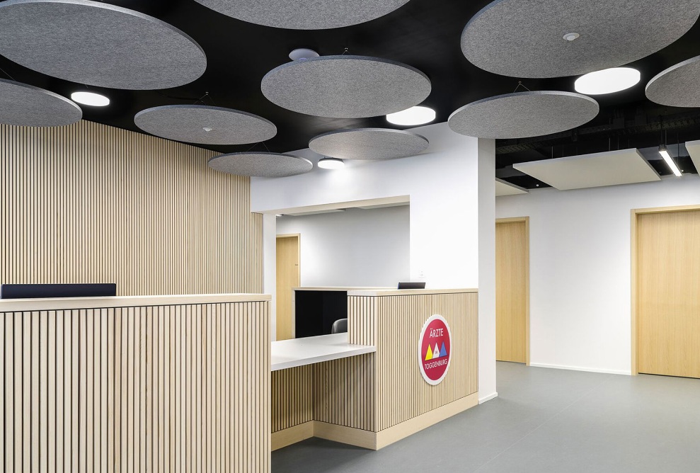 Reception area with timber interior finishing in Mosnang health centre