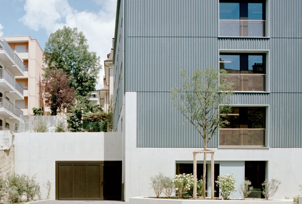 The facade and roof of the asylum centre are made of corrugated eternit 