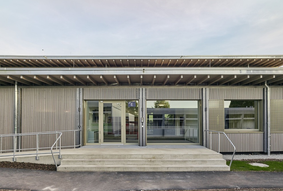 School building entrance with steps and ramp