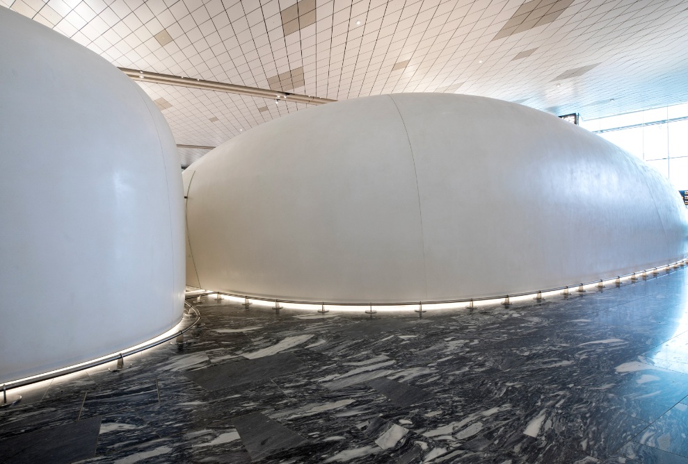 View of huge pavilions from the rear at the airport in Oslo on a marble floor