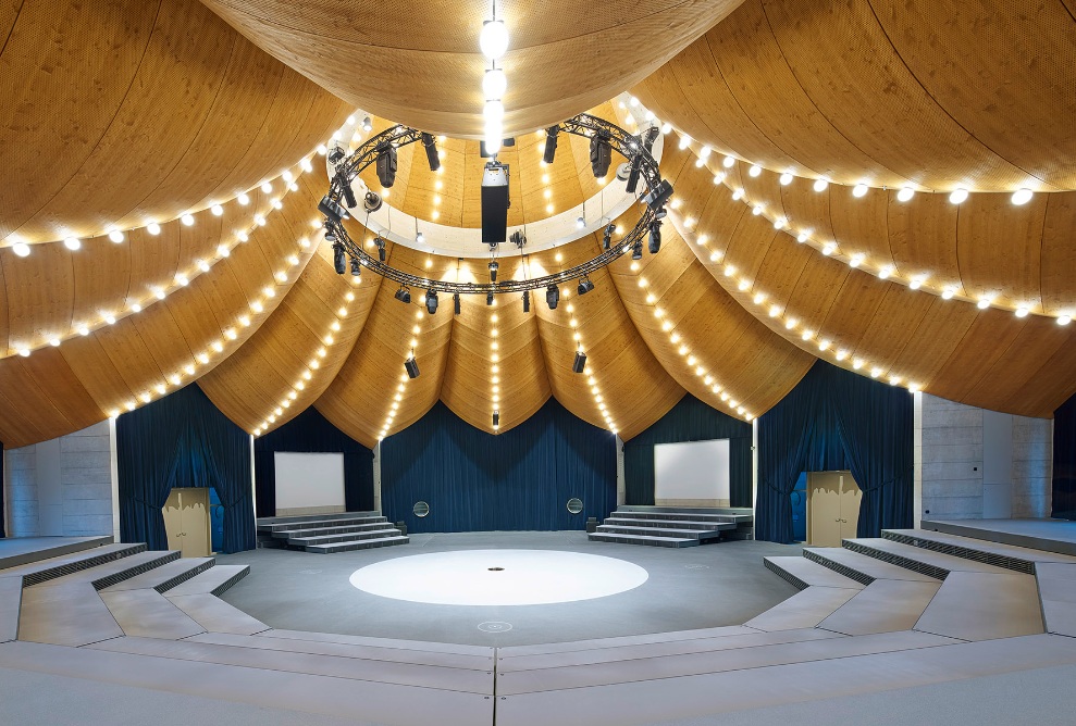The curved timber creates a circus-like atmosphere inside the magician’s hat. 