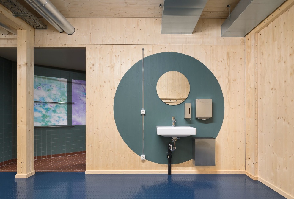 WC/shower/changing room area made of wood of the temporary gymnasium <br/>