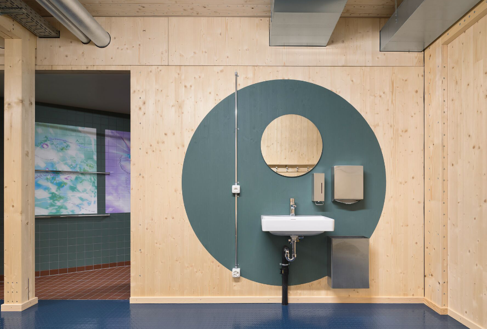 WC/shower/changing room area made of wood of the temporary gymnasium <br/>