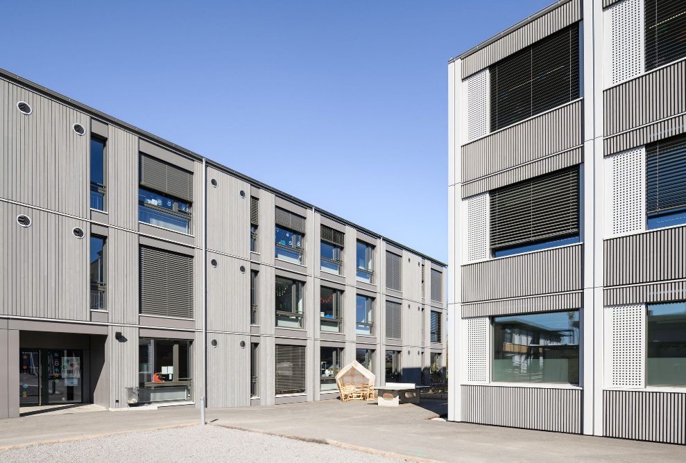 Exterior view of Herti school building in timber with modern facade design