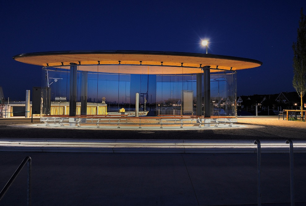 Night shot of the illuminated Stedi shelter.